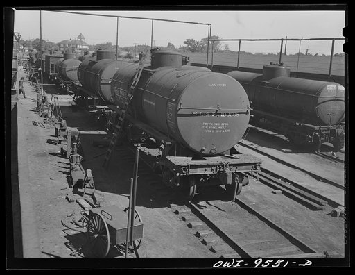 Untitled photo, possibly related to: Tulsa, Oklahoma. Oil tank cars and storage tanks