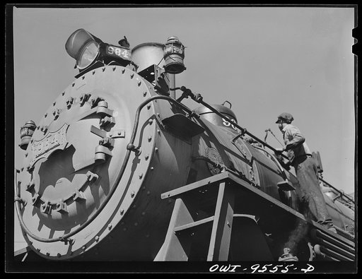 Tulsa, Oklahoma. Cleaning an engine at the roundhouse at the Frisco railroad