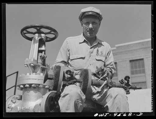 Untitled photo, possibly related to: Tulsa, Oklahoma. Pumping station engineer with an apparatus known variously as "pig", "go-devil" and "scraper". It is sent through the eight inch pipeline at intervals for cleaning, to remove obstructions and to detect leaks