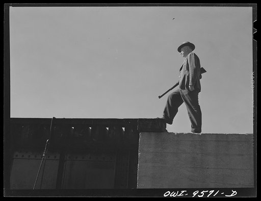 Untitled photo, possibly related to: Tulsa, Oklahoma. Armed guard at the railroad bridge