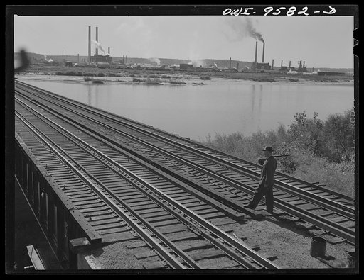 Untitled photo, possibly related to: Tulsa, Oklahoma. Armed guard at the railroad bridge