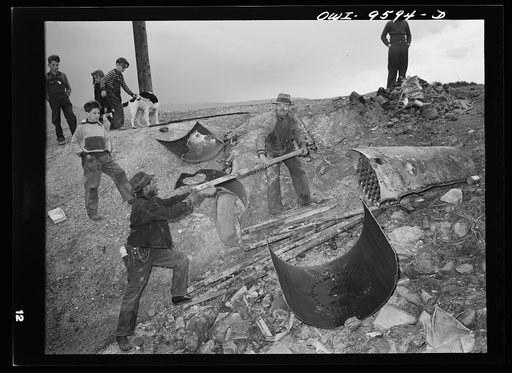 Untitled photo, possibly related to: Butte, Montana. Dismantling an old boiler during the scrap salvage campaign