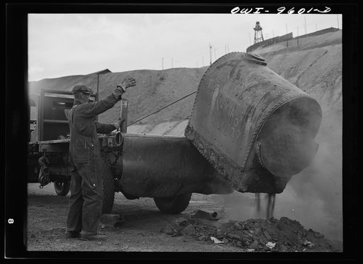 Butte, Montana. Loading part of an old boiler onto a truck during the scrap salvage campaign