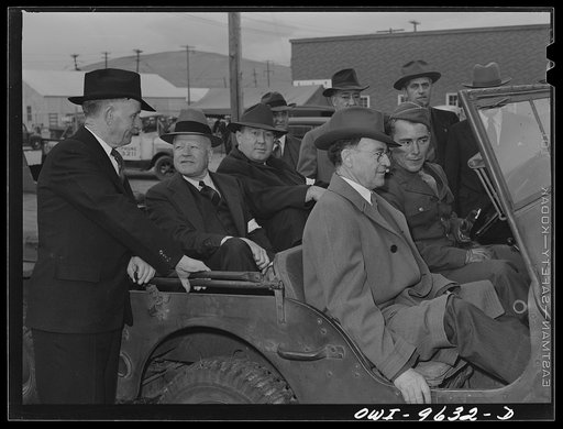 Butte, Montana. State and local officials get together at the scrap salvage campaign. Left to right: Mayor Barry O'Leary; ex-Governor L.A. Miller, now of WPB Denver, Colorado; William E. Rae, salvage chairman of Butte; Governor Ford; and Private R.C. Gurd, stationed at Fort Harrison