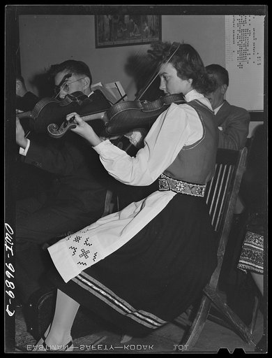 Butte, Montana. Musician at the Little Norway Knitting Club silver tea