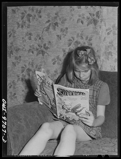 Untitled photo, possibly related to: Butte, Montana. Victor Rauh and one of his children reading a newspaper