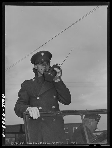Butte, Montana. Soldier with walkie-talkie radio helping in the scrap salvage campaign