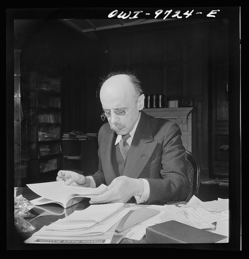 Washington, D.C. The Turkish Embassy. Ambassador Ertrogren [i.e., Ertegun] at work at his desk