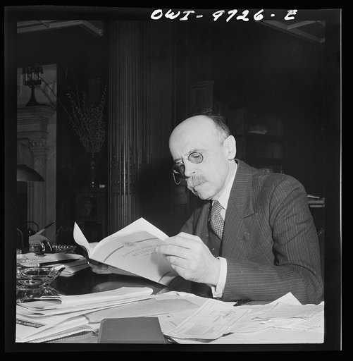 Untitled photo, possibly related to: Washington, D.C. The Turkish Embassy. Ambassador Ertrogren [i.e., Ertegun] at work at his desk