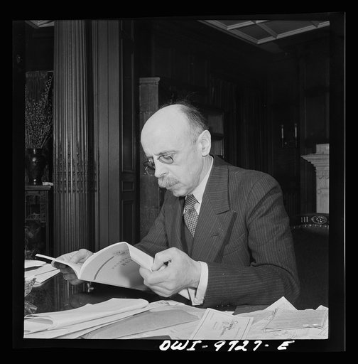 Untitled photo, possibly related to: Washington, D.C. The Turkish Embassy. Ambassador Ertrogren [i.e., Ertegun] at work at his desk