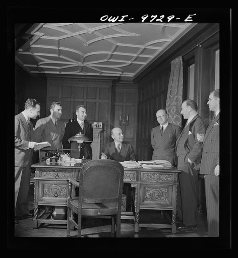 Washington, D.C. The Turkish Embassy. Ambassador Ertrogren [i.e., Ertegun] and his staff in his office