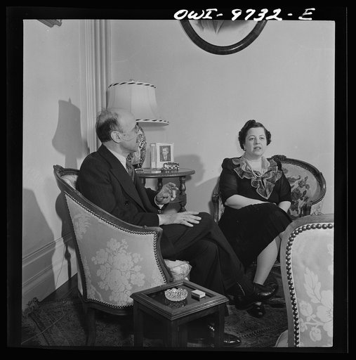 Washington, D.C. The Turkish Embassy. Ambassador and Madame Ertrogren [i.e., Ertegun] in their living room. Photograph of Vice-President Wallace on the table