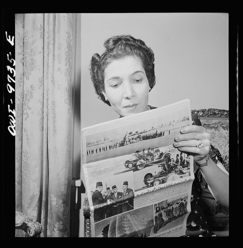 Washington, D.C. The Egyptian Legation on Massachusetts Avenue. Madame Hassan, wife of the minister, reading an Egyptian picture magazine