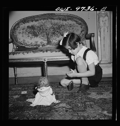 Untitled photo, possibly related to: Washington, D.C. The Egyption Legation on Massachusetts Avenue. Minister Hassan watches a card game between his wife and children