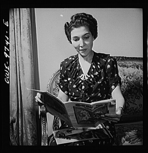Washington, D.C. The Egyptian Legation on Massachusetts Avenue. Madame Hassan, wife of the minister, reading an Egyptian picture magazine