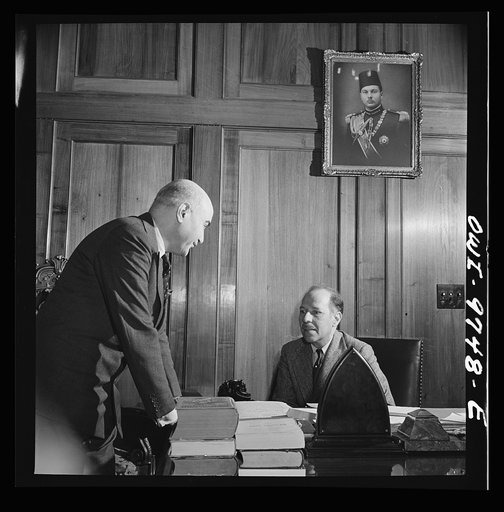 Untitled photo, possibly related to: Washington, D.C. The Egyptian Legation on Massachusetts Avenue. Minister Hassan conferring with a member of his staff