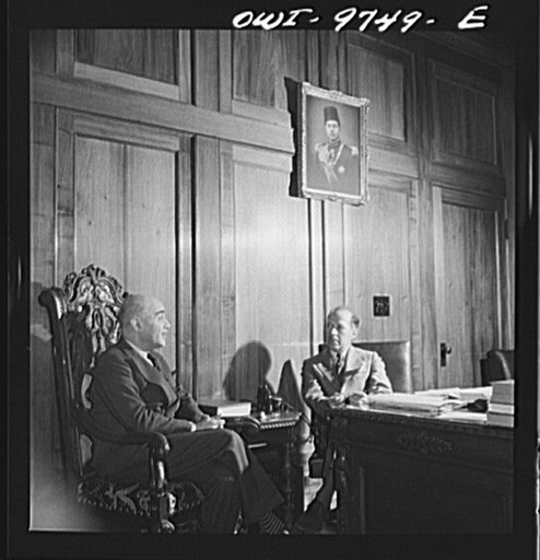 Washington, D.C. The Egyptian Legation on Massachusetts Avenue. Minister Hassan conferring with a member of his staff