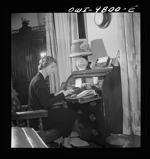 Untitled photo, possibly related to: Washington, D.C. The Netherlands Legation. Madame Louden, wife of the minister, is learning typing by herself to help her in war work