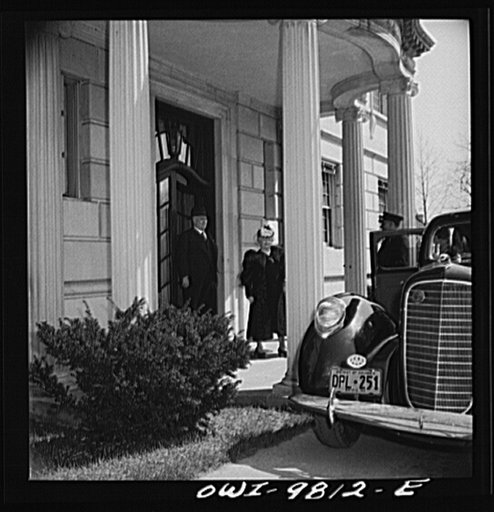 Washington, D.C. South African Legation on Massachusetts Avenue. Minister and Mrs. Close leaving the legation to enter their car