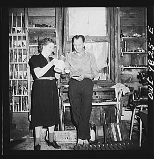 Passaic, New Jersey. Factory owner Carlson organized home machine shops for defense work. Home workshop owner's wife bringing coffee during the morning's work