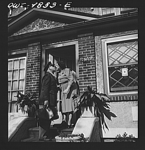 Brooklyn, New York. A section of the city largely inhabited by Finnish-Americans near 39th Street and 8th Avenue known as Finn Town. Lieutenant Palmrose greeting his mother as he comes home on leave. Father Palmrose is a lawyer and also a building constructor. He built his own home and others in the