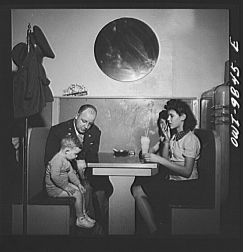 Brooklyn, New York. A section of the city largely inhabited by Finnish-Americans, near Thirty-ninth Street and Eighth Avenue, known as Finn Town. Lieutenant Palmrose buying sodas for his nephew and two cousins, while home on leave for Sunday