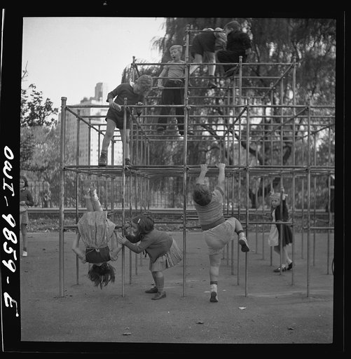 New York, New York. Janet and Marie Wynn [or Winn] (lower left), Czech-American children, climbing on monkey bars in Central Park playground