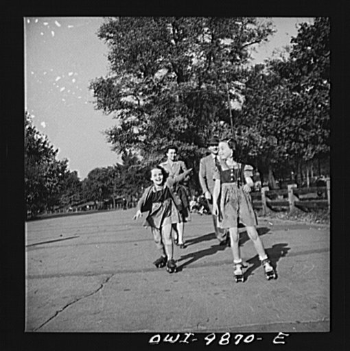 New York, New York. Janet and Marie, Czech-American children, roller-skating in Central Park. Dr. and Mrs. Winn [or Wynn] are walking behind