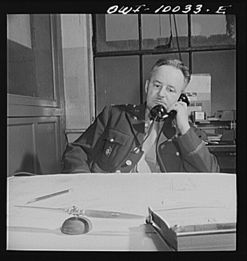 Washington, D.C. Colonel A.I. Ennis, chief of United States Army Air Corps Office of Public Relations at his desk in the munitions building