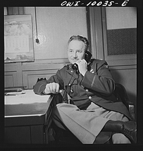 Washington, D.C. Colonel A.I. Ennis, chief of United States Army Air Corps Office of Public Relations at his desk in the munitions building