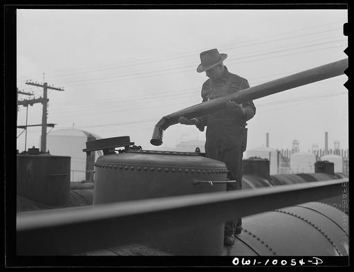 Tulsa, Oklahoma. Placing a spout in a tank car preparatory to laoding it at the Mid-continent refinery