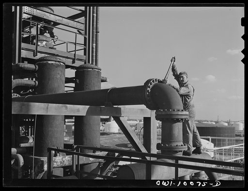 Tulsa, Oklahoma. Employee at a crude pipe still at the Mid-continent refinery