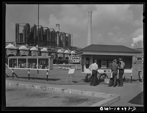 Tulsa, Oklahoma. Employees at a bulletin board at the Mid-continent refinery