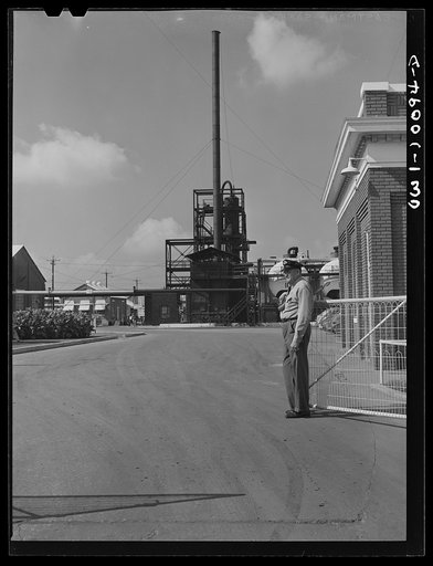 Tulsa, Oklahoma. Guard at the main entrance to the Mid-continent refinery