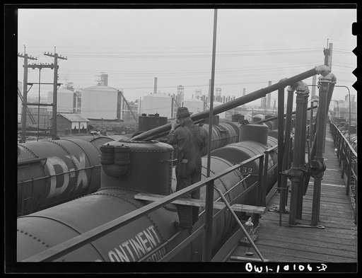 Untitled photo, possibly related to: Tulsa, Oklahoma. Loading a tank car at the Mid-continent refinery