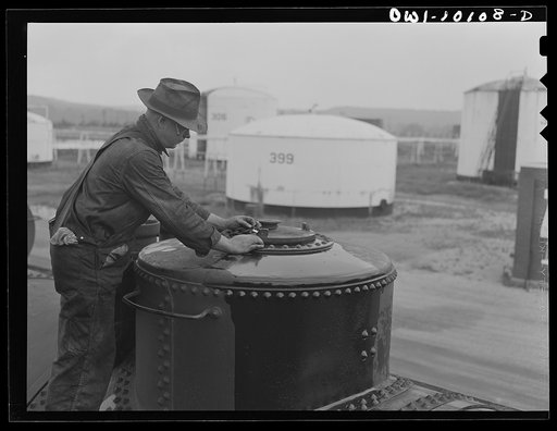 Tulsa, Oklahoma. Sealing a tank car loaded with gasoline at the Mid-continent refinery