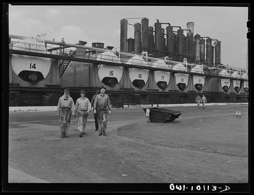 Tulsa, Oklahoma. Workers leaving the grounds at the noon hour at the Mid-continent refinery