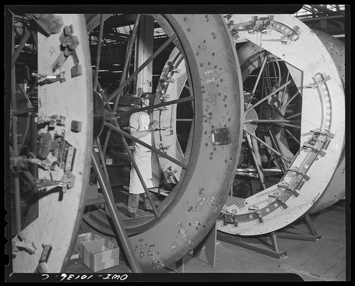 De Soto bomber plant. Detroit, Michogan. Loading the frames on the assembly fixture of the nose section. This is the first operation in the sub-assembly operation