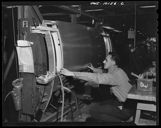 De Soto bomber plant, Detroit, Michigan. Fitting skin to a side panel
