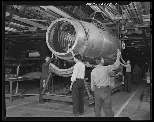 De Soto bomber plant, Detroit, Michigan. Loading final assembly trucks