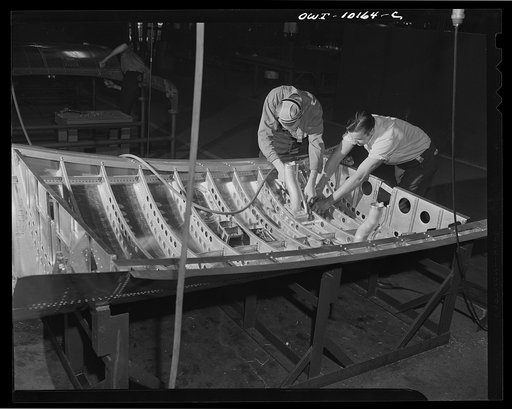 De Soto bomber plant, Detroit, Michigan. Touch-up operation and inspection on the crown assembly