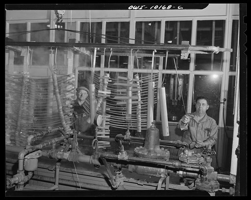 De Soto bomber plant, Detroit, Michigan. Dipping parts that are held by the springs in a plating solution