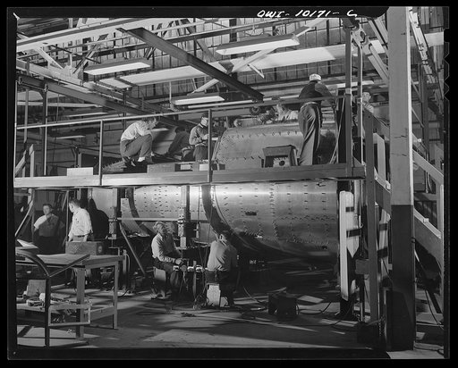 De Soto bomber plant, Detroit, Michigan. Semi-final fabricating of the nose section in major fixture