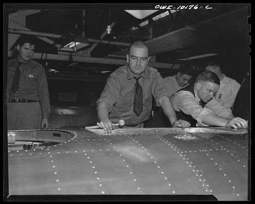 De Soto bomber plant, Detroit, Michigan. Final installation of the life raft section