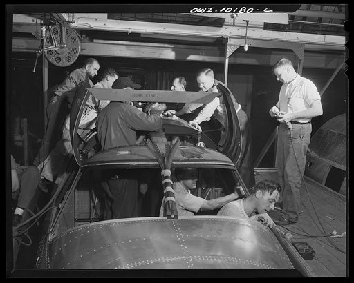 De Soto bomber plant, Detroit, Michigan. Installation of the pilot enclosure in the nose section