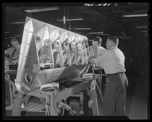 De Soto bomber plant, Detroit, Michigan. Inspection of the wing flap