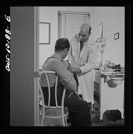 New York, New York. A Czech physician, Dr. Winn [or Wynn], treating a patient in his office