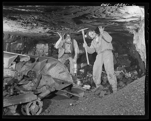 Pittsburgh, Pennsylvania. (vicinity) Montour no. 4 mine of the Pittsburgh Coal Company. Testing for bad ceiling by sounding with the handle of a pick. If the slate is loose, it is pulled down till the ceiling becomes solid, or if it is very rotten, it is timbered