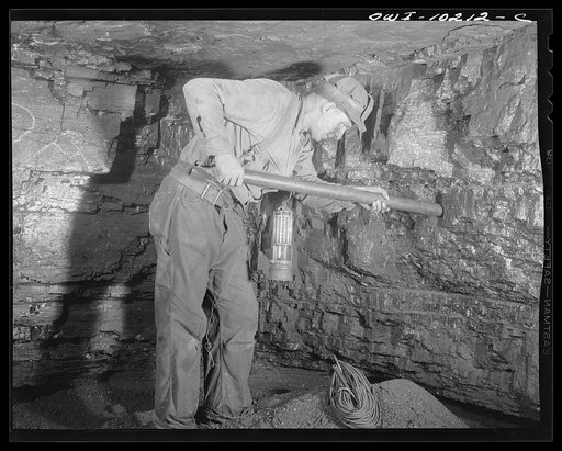 Untitled photo, possibly related to: Pittsburgh, Pennsylvania (vicinity). Montour no. 4 mine of the Pittsburgh Coal Company. Placing a Cordox shell in place before blasting.