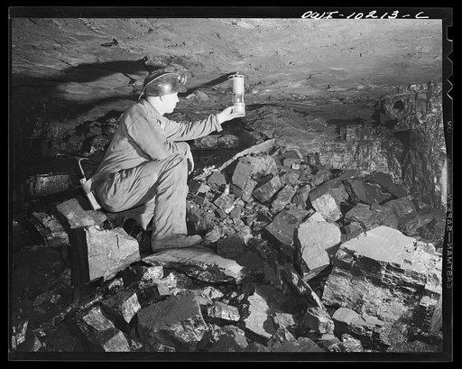 Pittsburgh, Pennsylvania (vicinity). Montour no. 4 mine of the Pittsburgh Coal Company. Testing for gas with a safety lamp; if there is gas, the lamp will burn with a blue flame. The screening keeps the open flame confined but lets the gas in
